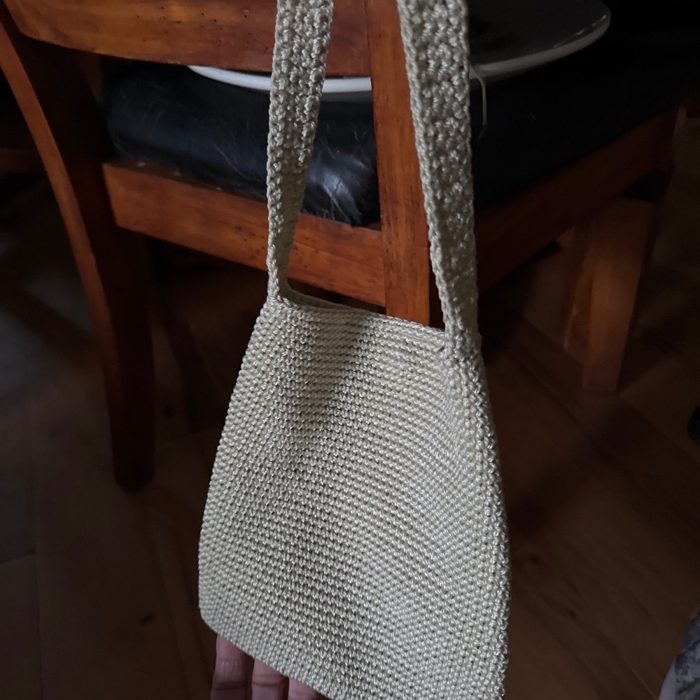This  bag is a offwhite crochet boho slouch shoulder zip top bamboo ring strap